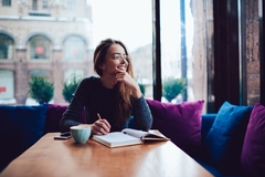 Image woman studies with coffee in cafe