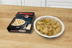 Image Potatoe wedges on paperboard tray.