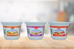 Image Yogurt cups on table.