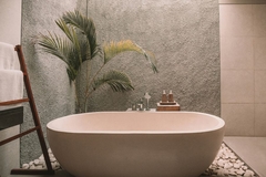 A luxury hotel bathroom with personal care products.