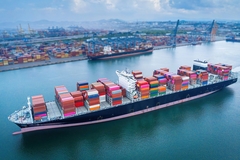 a cargo ship sailing in the ocean.