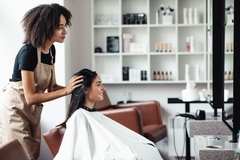 Image Salon worker cutting woman's hair
