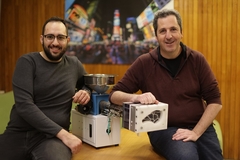 two scientists with injection molding machine.