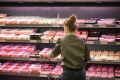 Image A shopper buying meat.