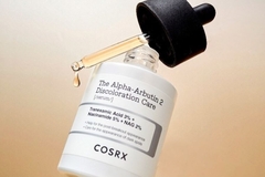Cosrx serum bottle open with some of the serum falling out.