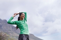 Image Woman stretching outside.