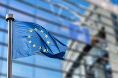 EU flag and European Commission building.