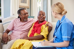 Image Black hetero couple on couch talks with doctor on couch