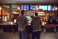 Image Two people choosing a fast food option with lower calories.