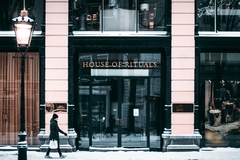 Image Man walking in front of Rituals store in Amsterdam.