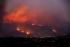 Image A wildfire in the hills in California.