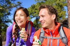 Image Man and woman eating fiber fortified snack.