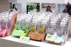 Image A shelf with a variety of hand soap packaging