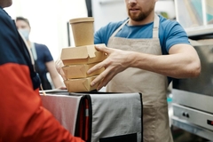 Image man holding food and beverage carton
