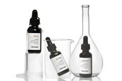 Image A collection of Minimalist skin care products and science tools.