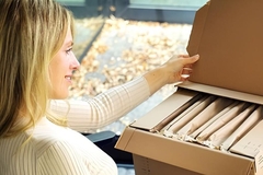 Image A person opening a box
