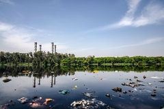 Image river with plastic in it with factory