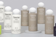 Image line of haircare bottles in beige
