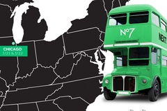 Image A green bus next to a map of the US with Chicago pointed out.