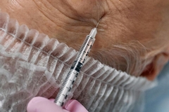 Image Woman getting injection in face
