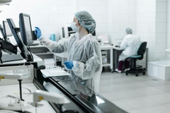 Scientist working on a computer in a lab