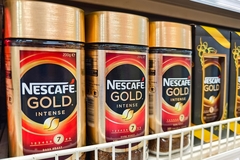 Nescafe in supermarket aisle.