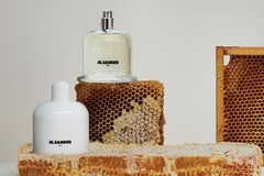 Image Perfume bottle and lid on honeycomb