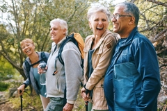 Image Happy and healthy seniors walking outside