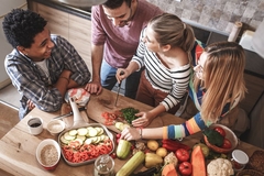 Group of people cooking whole foods