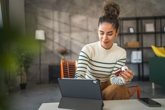 Image Woman checking supplement label online.