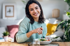 Image happy woman eats healthy food