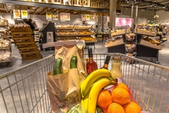 Image A shopping cart full of food.