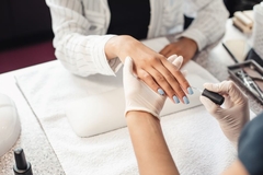 Image A woman getting a manicure.