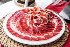 Image Plate of acorn-fed Iberian ham on the table at an event