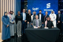 Ericsson and Iot signing papers on table