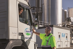 Image Female tanker driver talking to male tanker driver