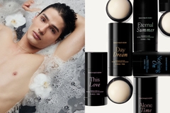 Image attractive man in bath with rose petals and deodorant on this right