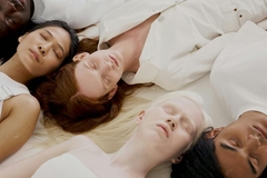 Image People with multiple skin tones laying on floor