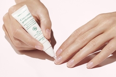 hands used small tube on nail bed