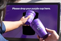 Two people holding cups in their hands