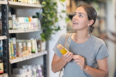 Woman holds personal care packaging