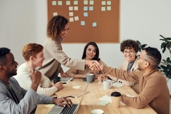 Image A group of people at a boardroom.
