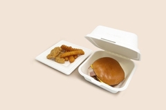 Image A burger and fries in a container