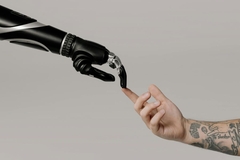 Image Robotic arm meeting human arm