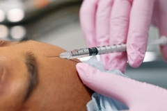 Image Woman getting injection in face