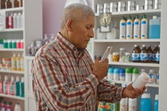 Consumer scanning a supplement bottle