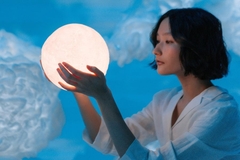 Image Woman in fantasy setting holding the moon