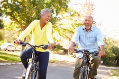 Image Healthy seniors biking outside