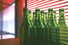 Image A group of green glass bottles