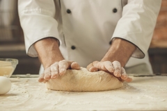 Chef making dough for bread.
